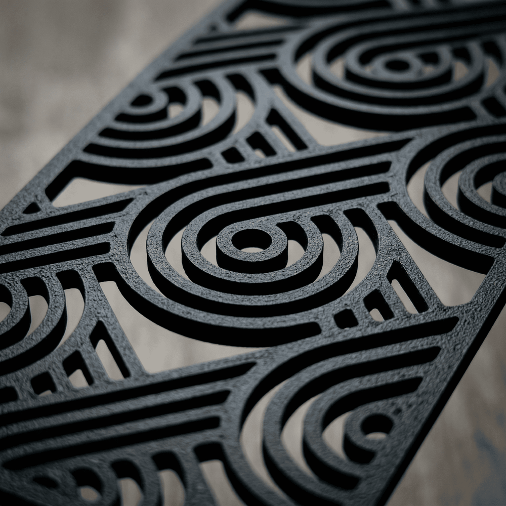 Close-up of a black bookmark with intricate geometric pattern