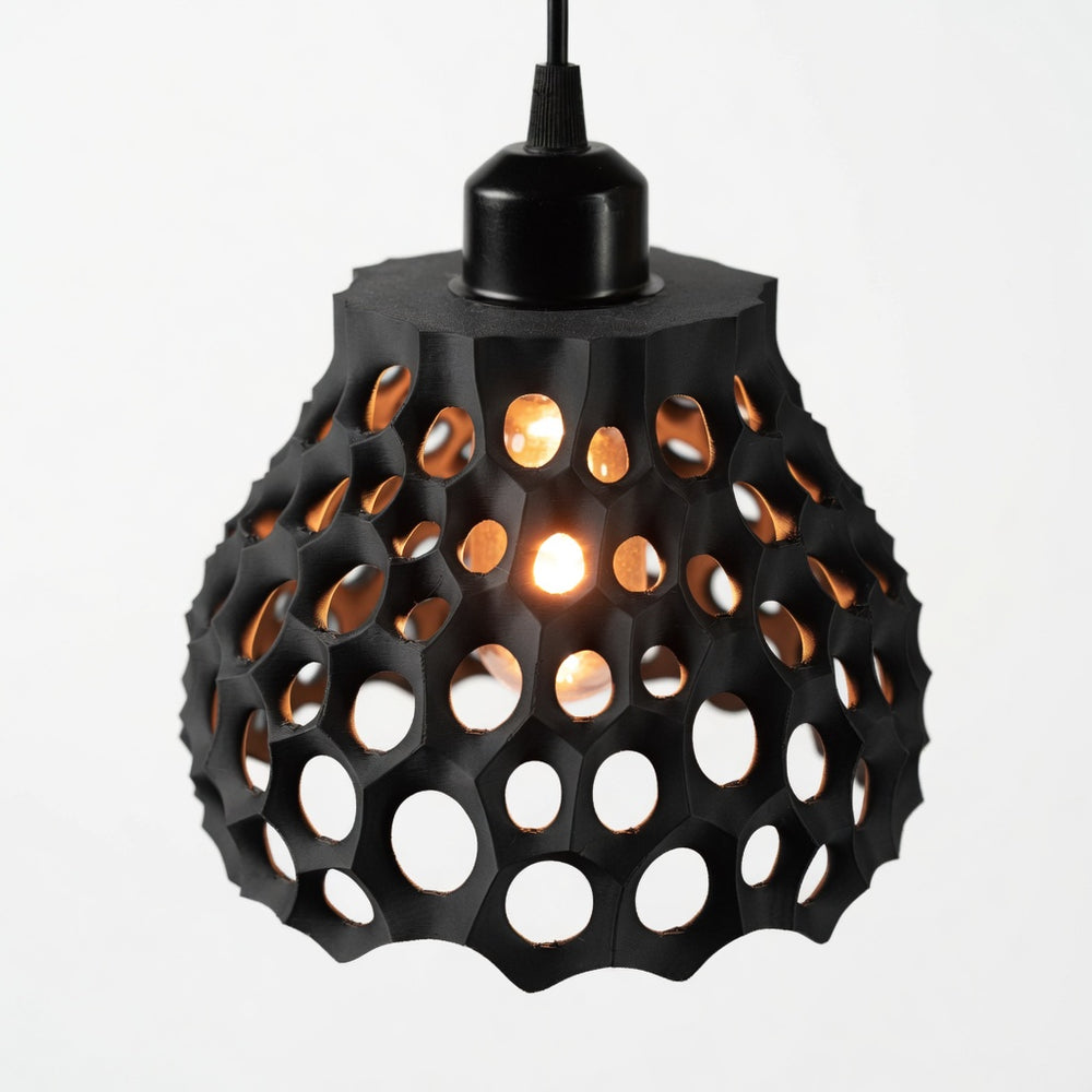 Black geometric pendant light on a white background
