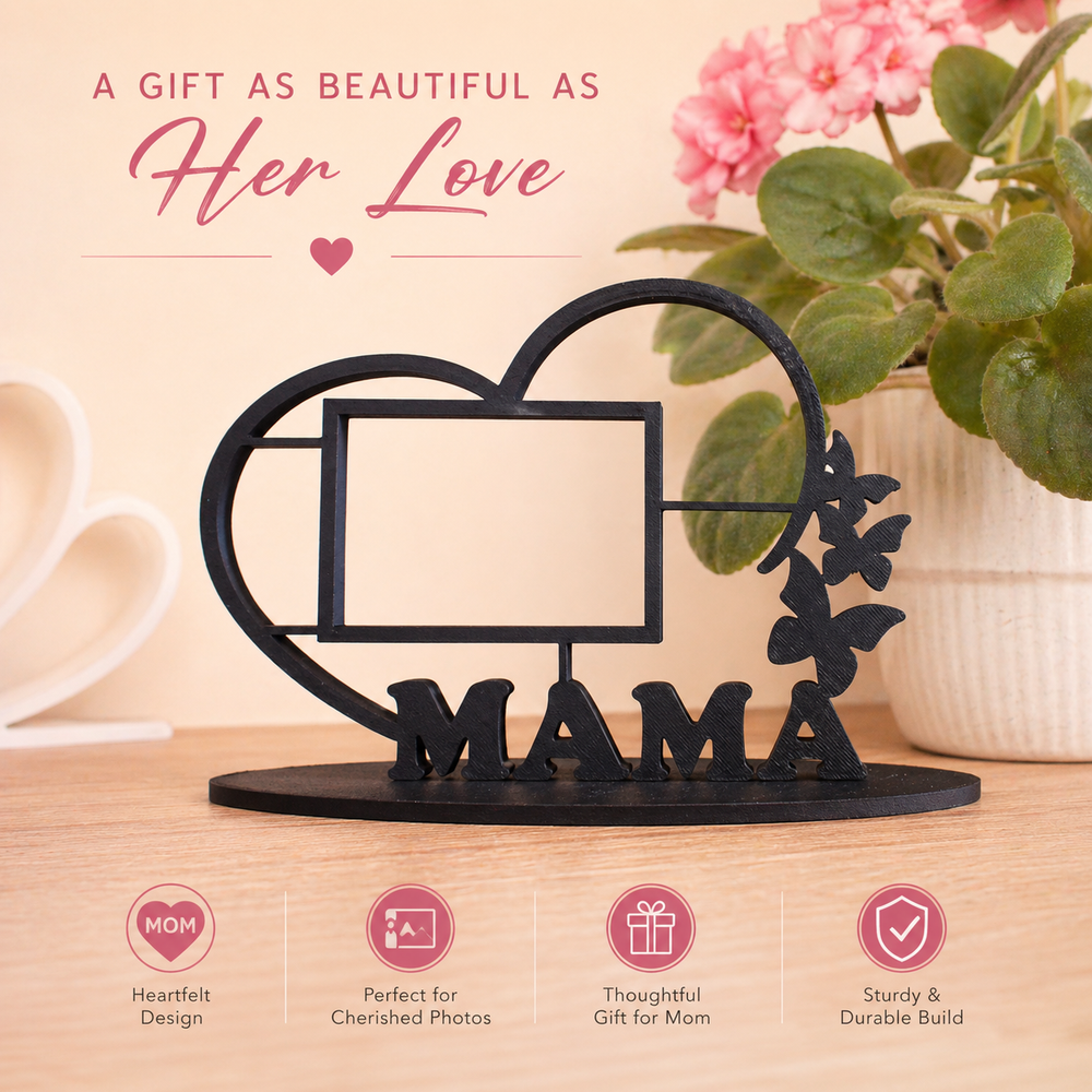 Decorative metal frame with 'MAMA' on a wooden surface with a plant in the background.