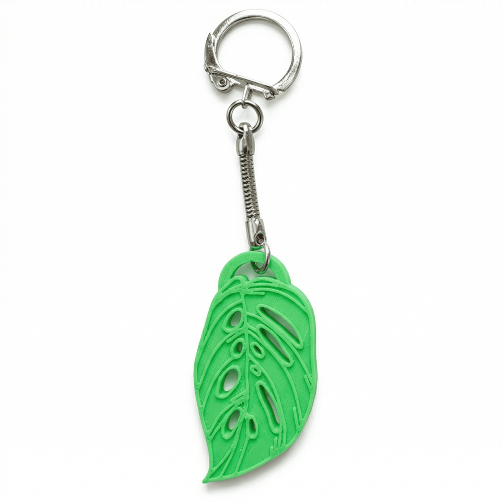 Green leaf-shaped keychain on a white background
