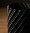 Close-up of a metal gear on a dark background