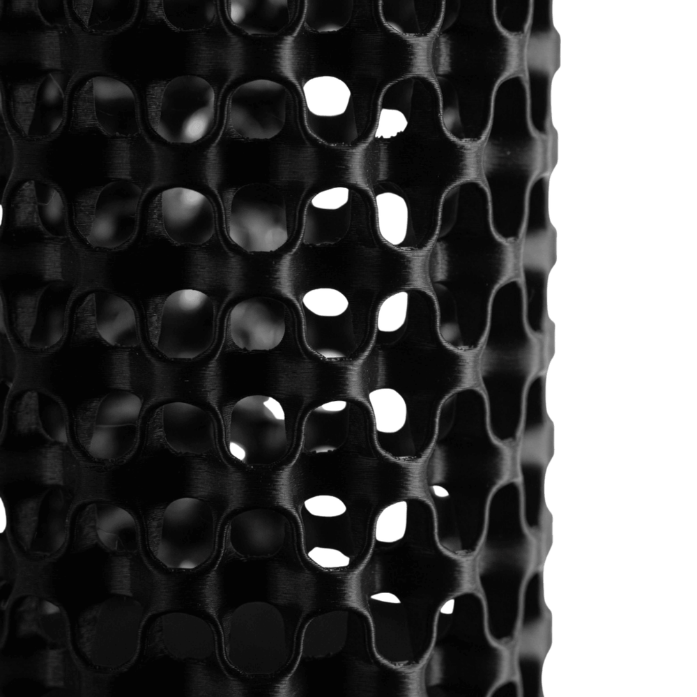 Close-up of a black textured surface with a geometric pattern