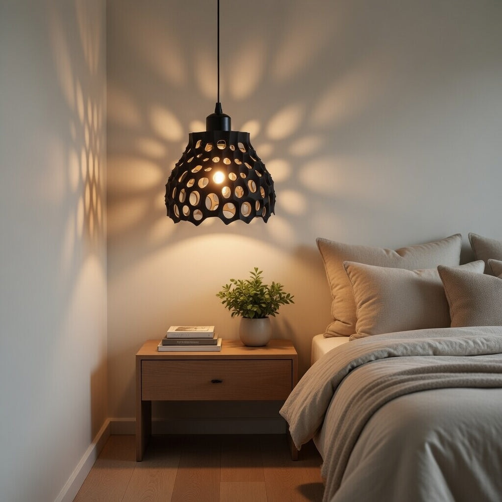 Modern bedroom with a pendant light, nightstand, and bed.