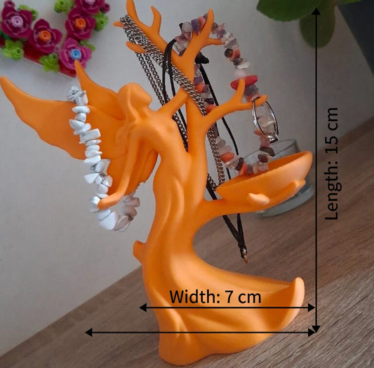 Orange coral-shaped jewelry holder with necklaces on a wooden surface, dimensions indicated.
