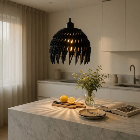 Modern kitchen with a black pendant light, cutting board with lemons, and flowers on a marble island.