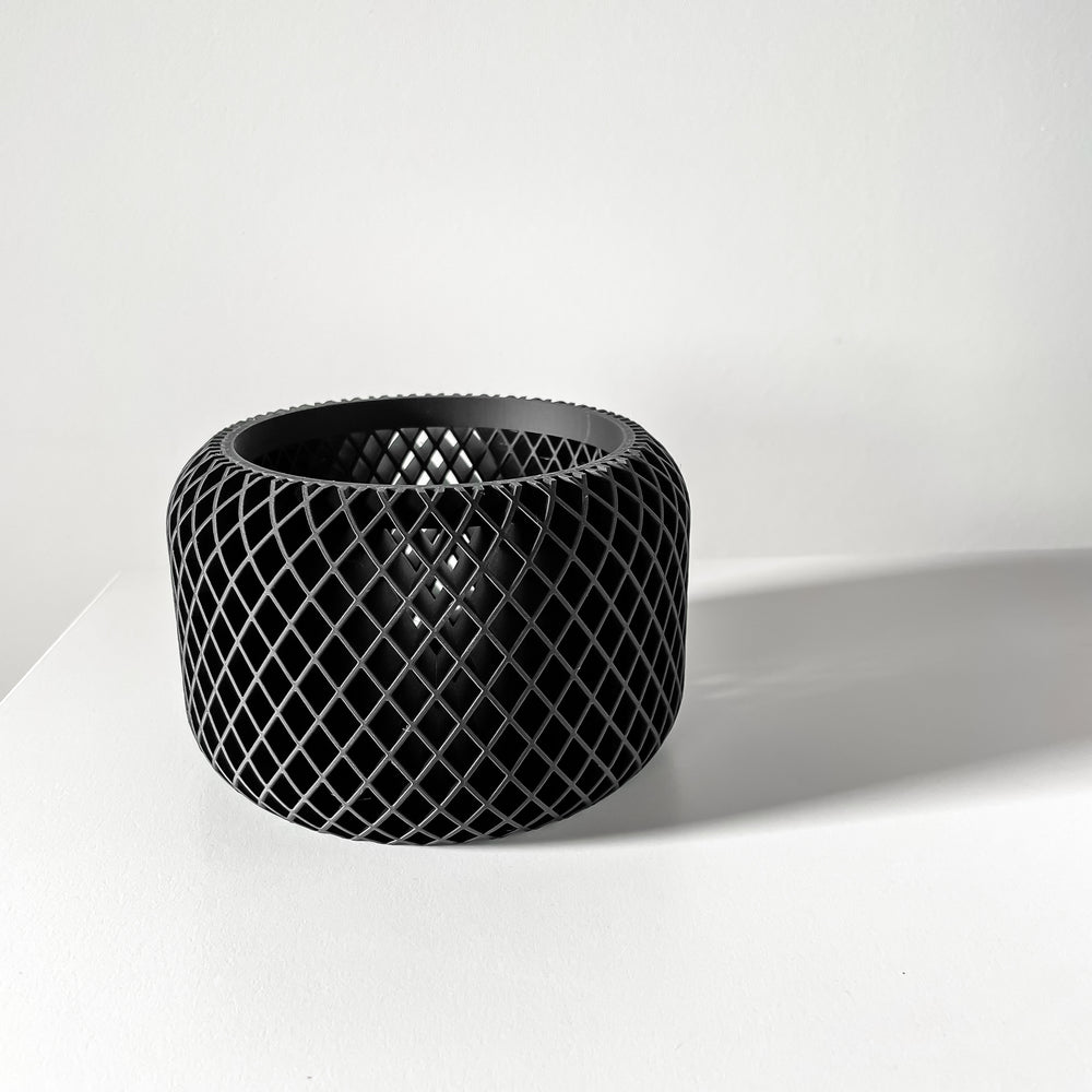 Black woven basket on a white background