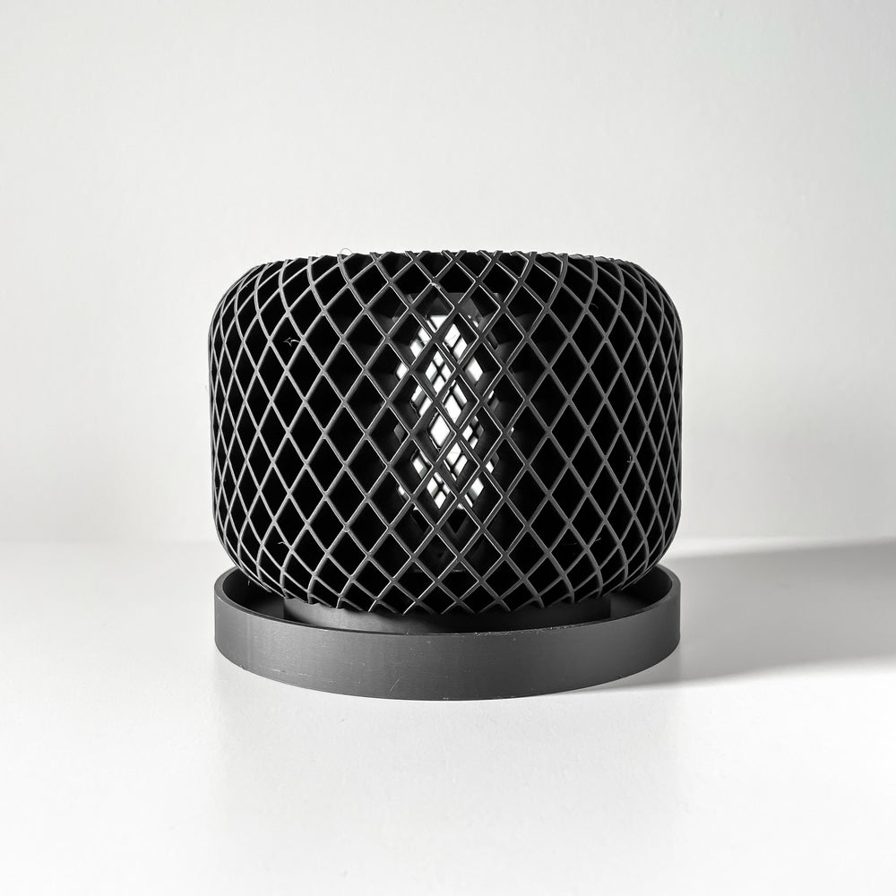 Black lattice-patterned planter on a white background